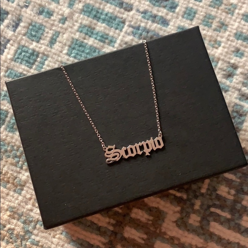 Scorpio Necklace Dipped In White Gold...